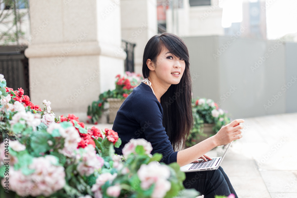 young asian woman with laptop