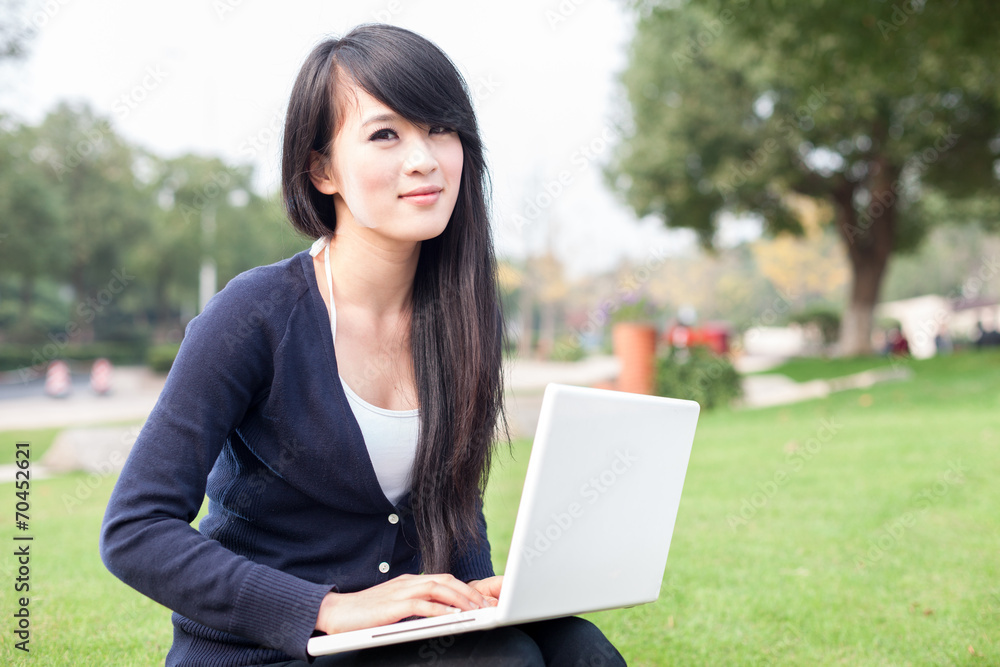 young asian woman with laptop