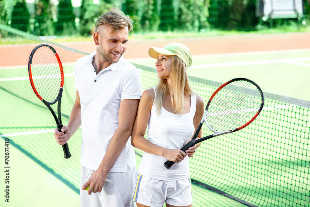 Young couple playing tennis