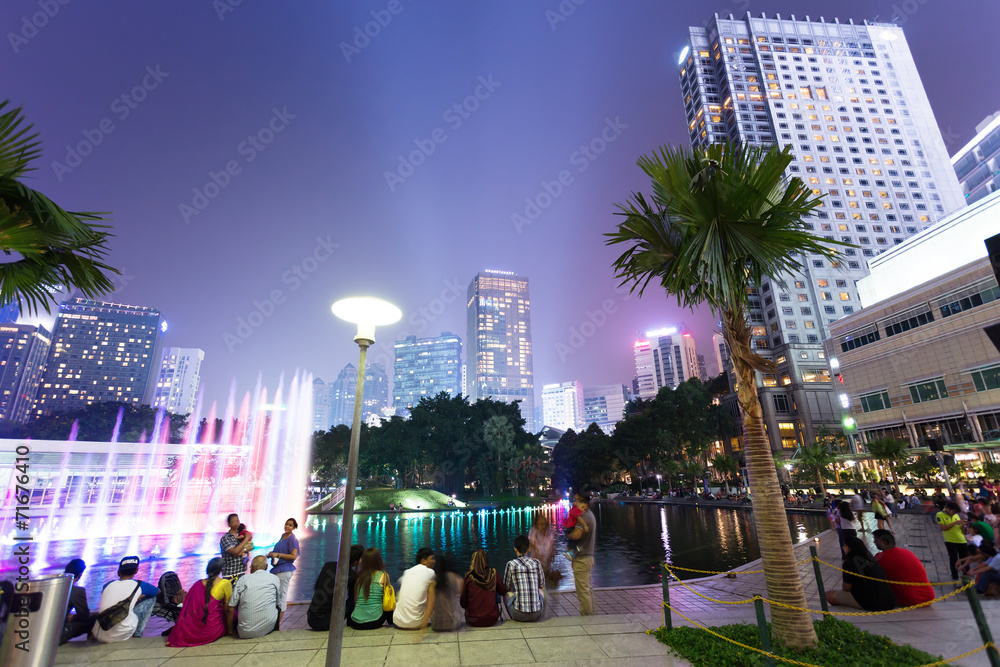 Tourists enjoys short break at the new musical fountain.