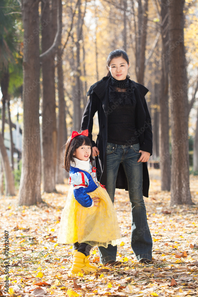 mother and daughter happy togetherness outdoor in forest