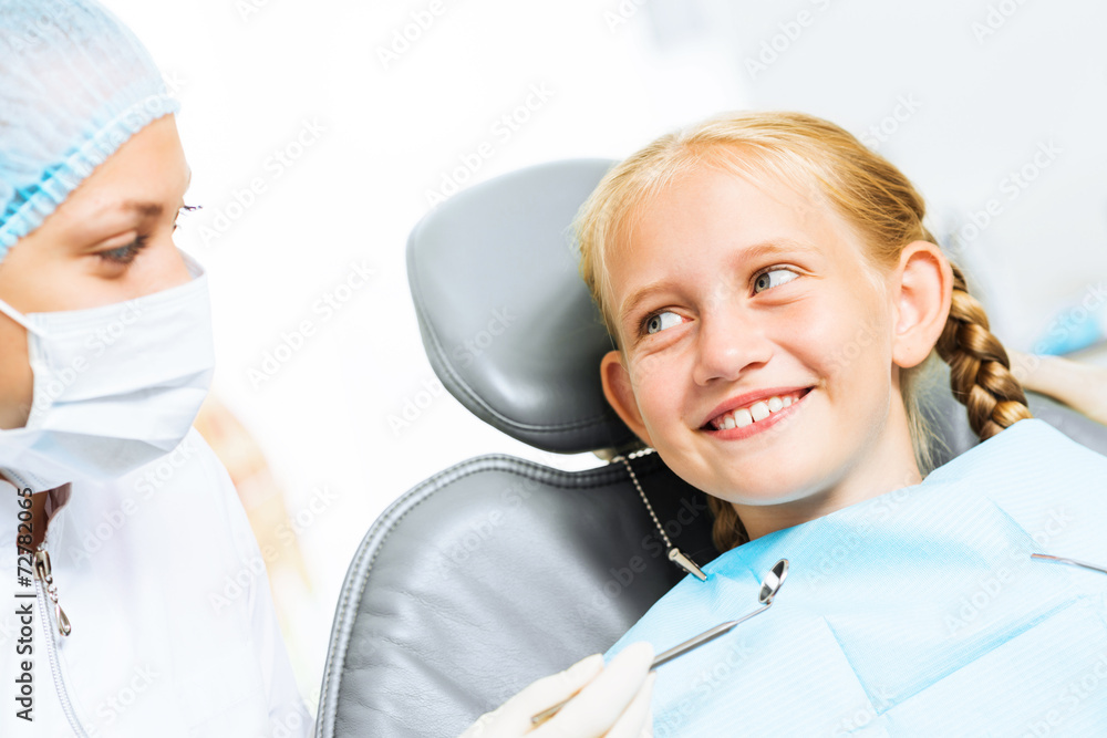 Dentist inspecting patient