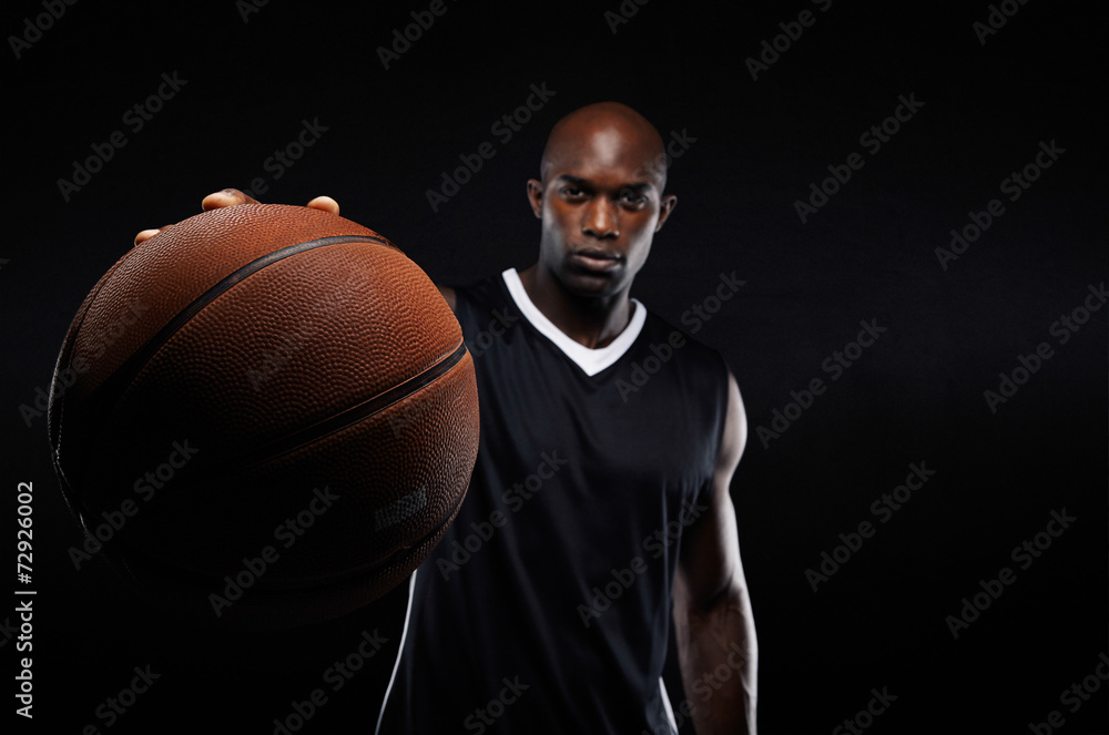 Young man holding a basketball