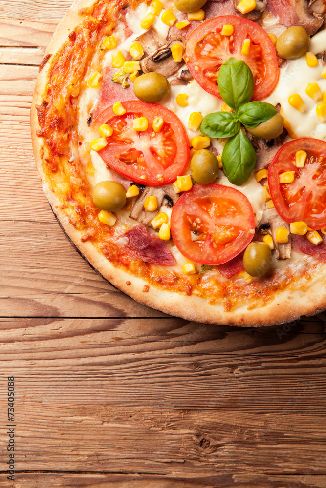 Delicious fresh pizza served on wooden table