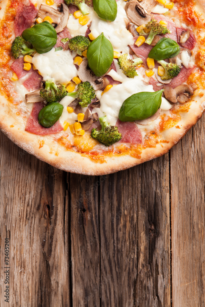 Delicious fresh pizza served on wooden table