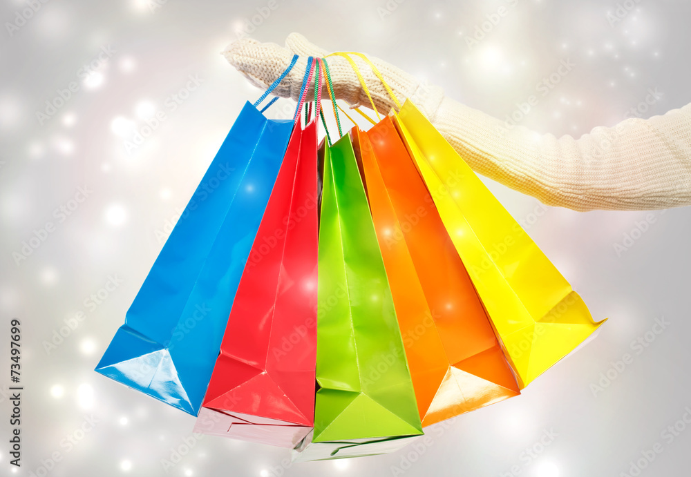 Woman holding colorful shopping bags