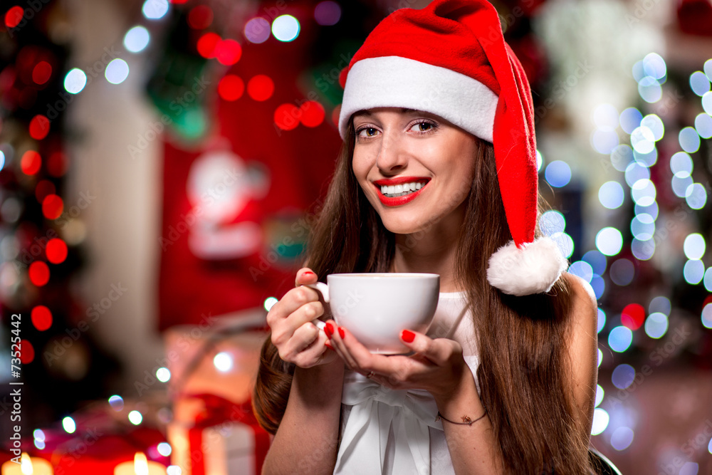 Young woman with coffee cup on Christmas