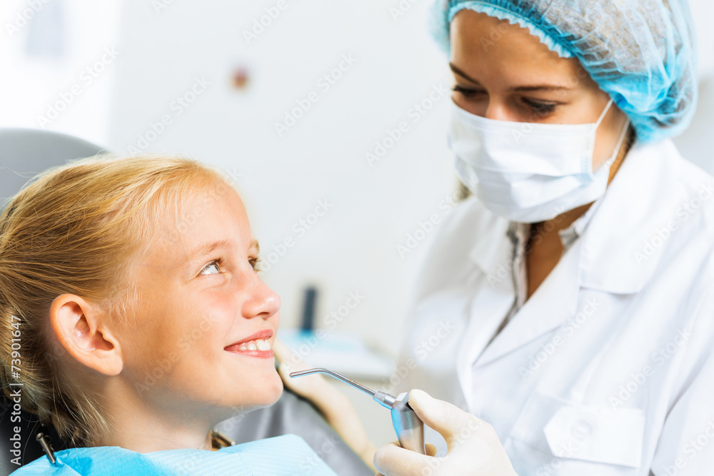 Dentist inspecting patient