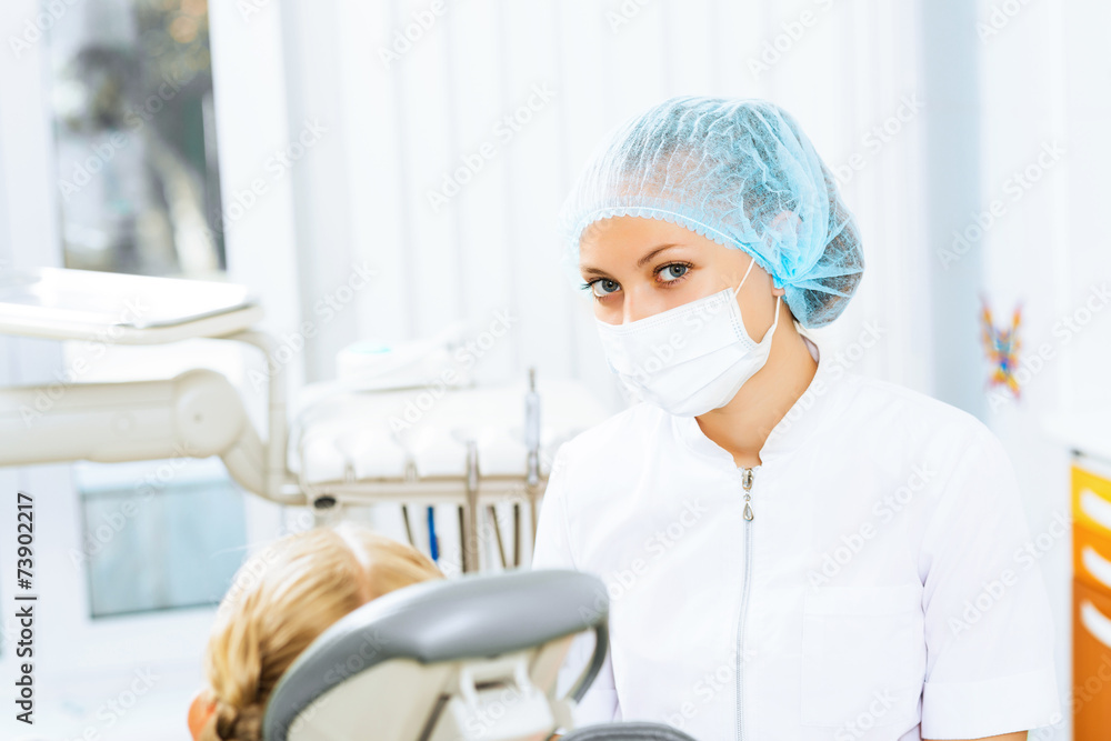 Dentist inspecting patient