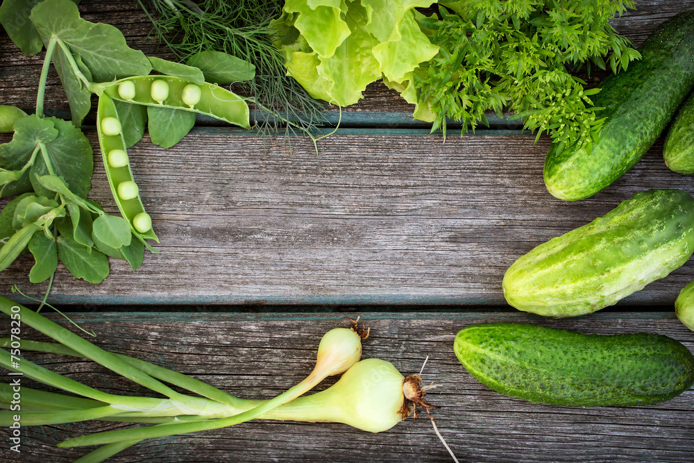 Green vegetables on wooden board