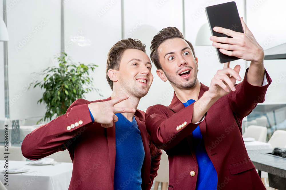 Brothers twins taking selfie photo