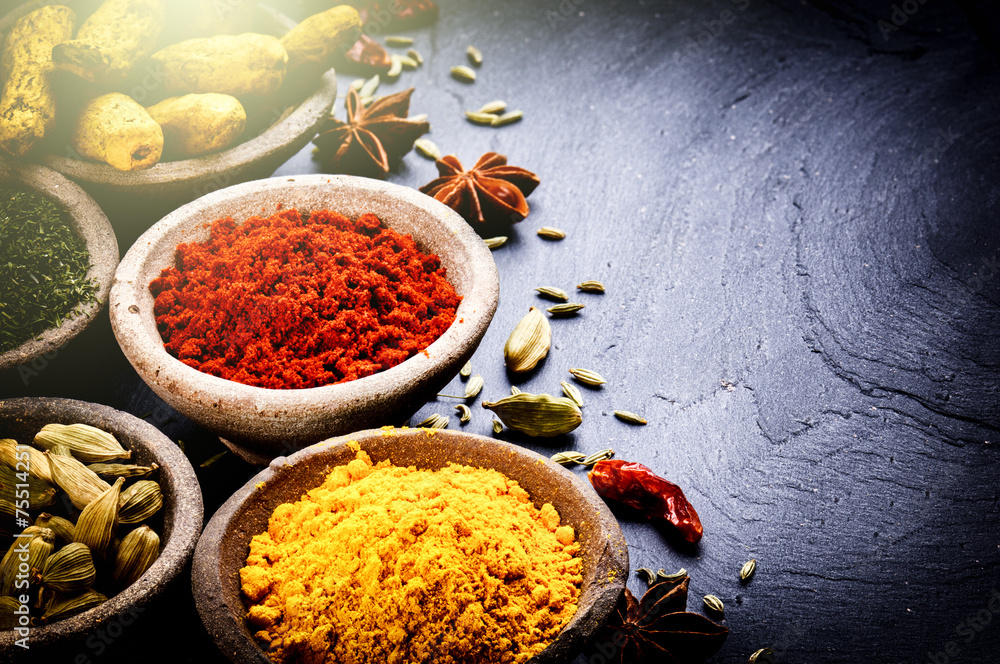 Colorful mix of spices on dark background