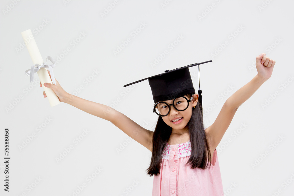 Happy Asian school kid graduate in graduation cap