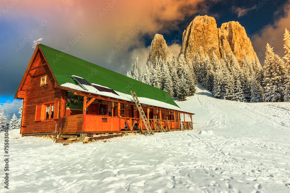 Colorful winter sunset and shelter,Carpathians,Romania,Europe