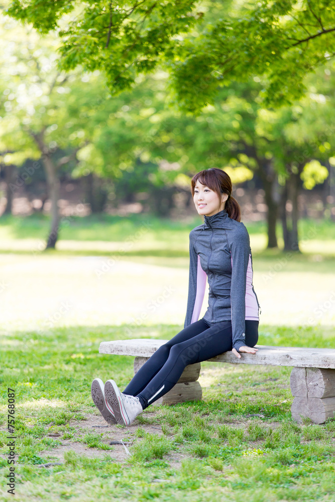 young asian woman relaxing in the park