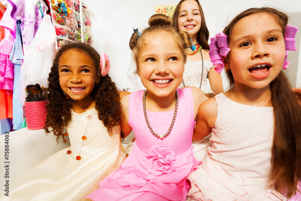 Close-up view of beautiful girls with hair-curlers