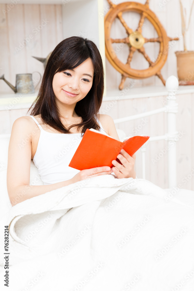 young asian woman in the bed room