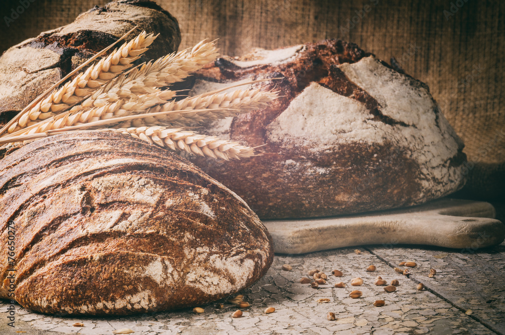 Selection of freshly baked bread in rustic setting