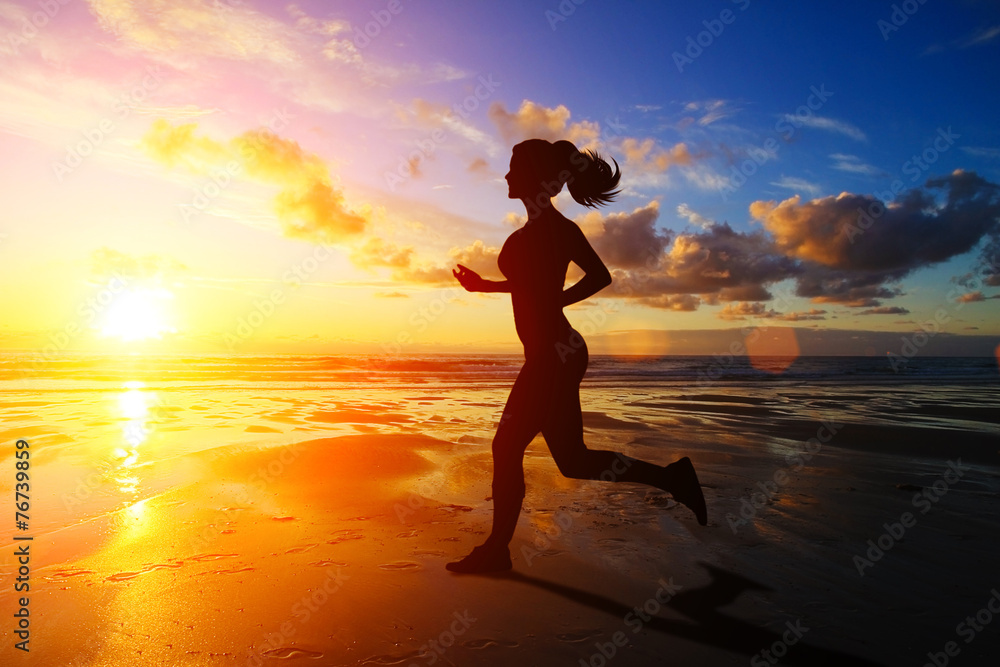 Running girl at sunset silhouette