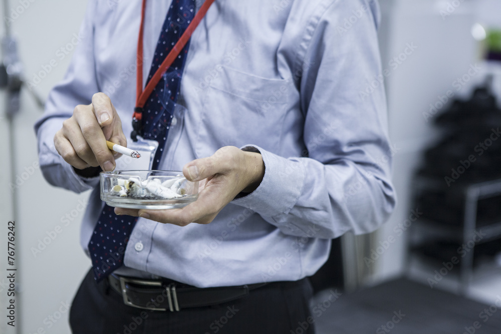 Businessman sucking tobacco