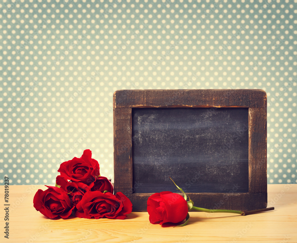 Blank rustic blackboard with roses