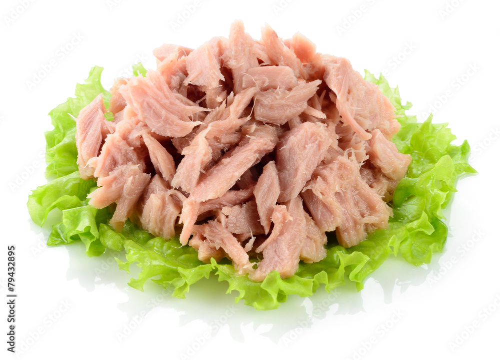 Tuna. Canned fish on green lettuce leaf