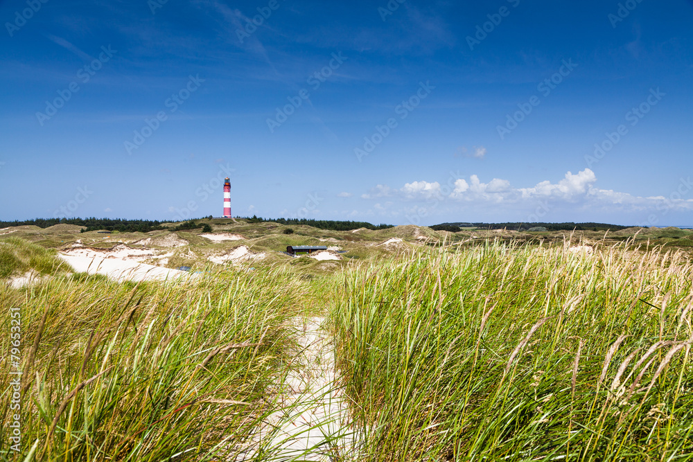 Dune landscape with lighthouse at North Sea, Germany