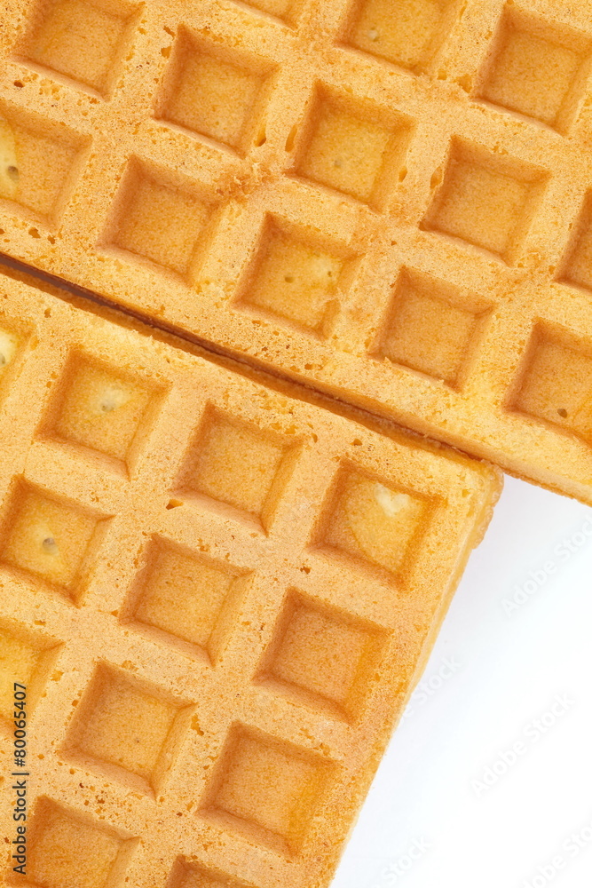 Close - up Delicious sweet waffle on white background .