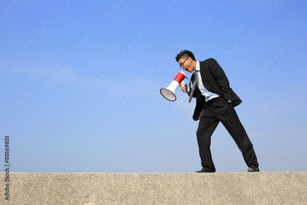 business man using megaphone