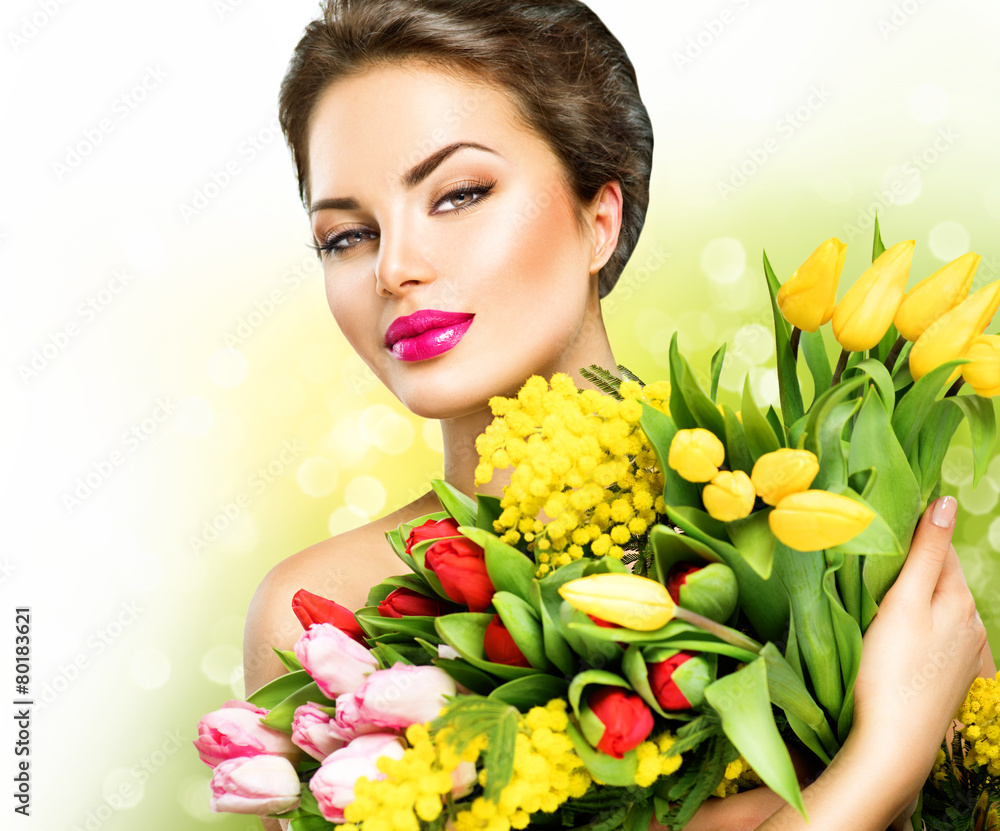 Beauty model woman with spring flowers bouquet