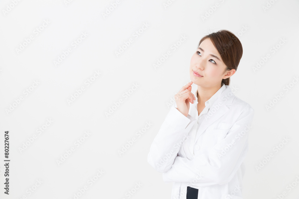 young asian doctor on white background