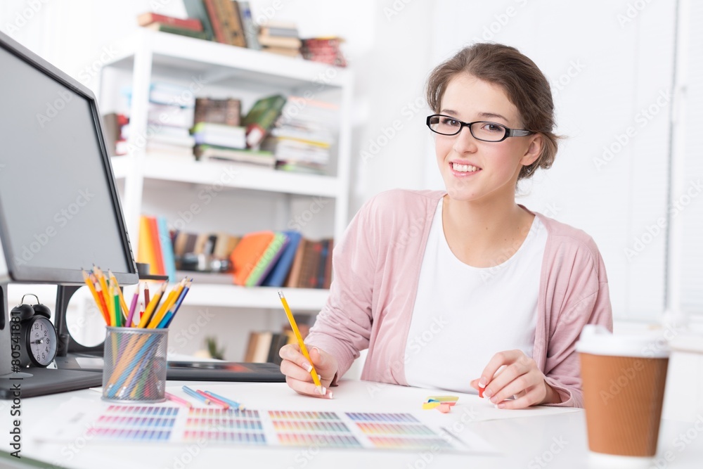 Designer. Portrait of a young graphic designer sketching at home