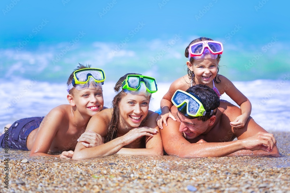 Beach. Family With Snorkels Enjoying Beach Holiday