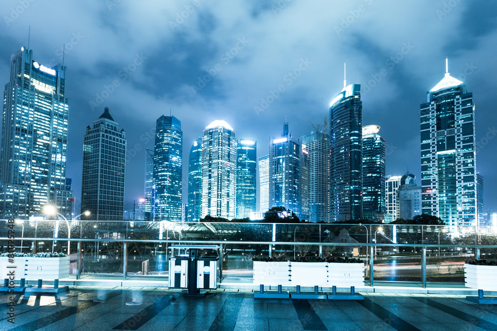 modern street,illuminated skyline and skyscrapers