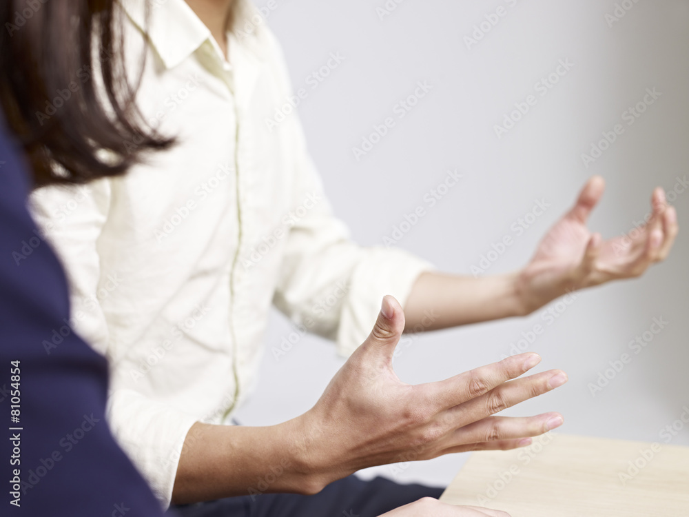 hand gesture of a talking young man