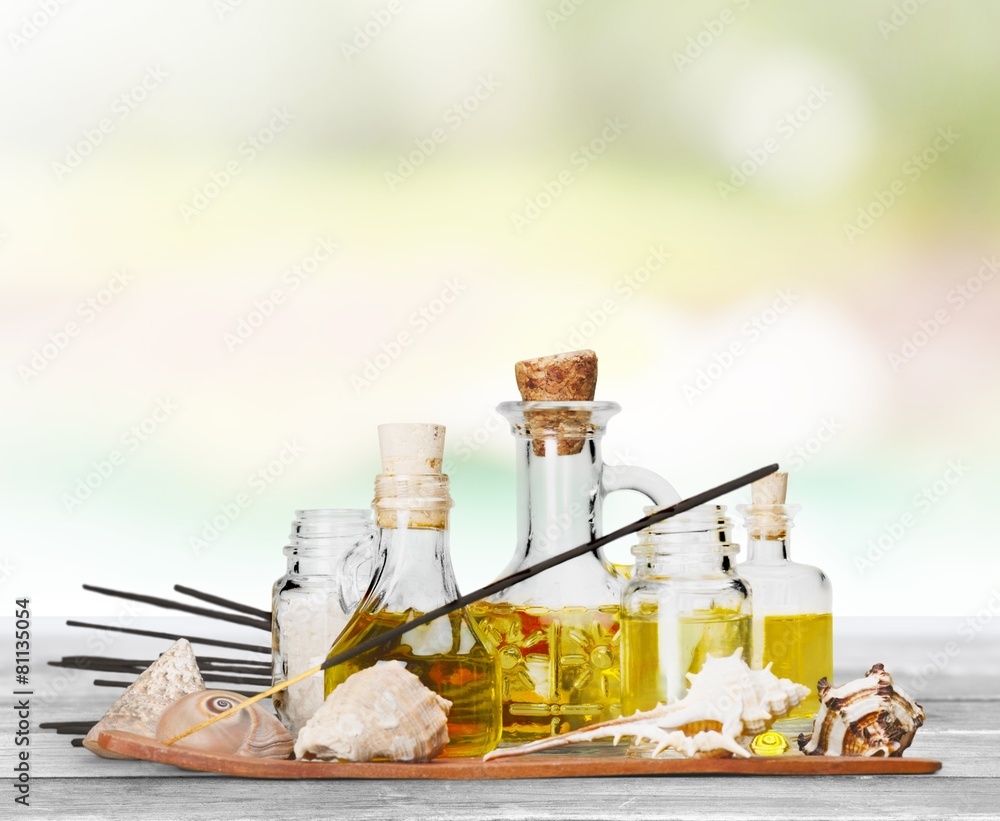 Aromatherapy. Soap bottles composition with shells and incense