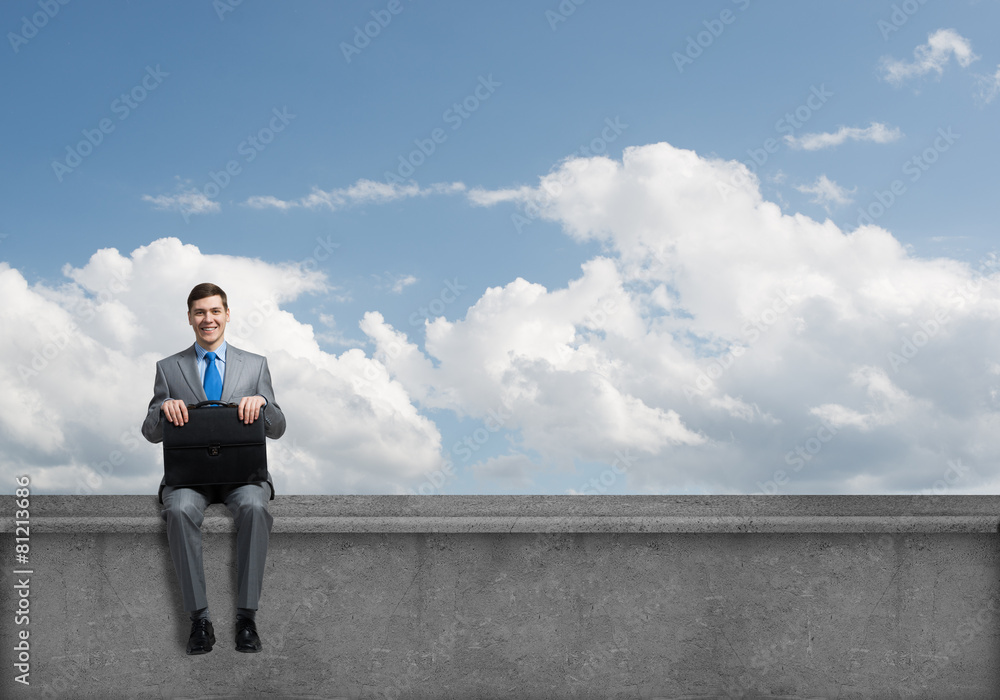 Young businessman with suitcase