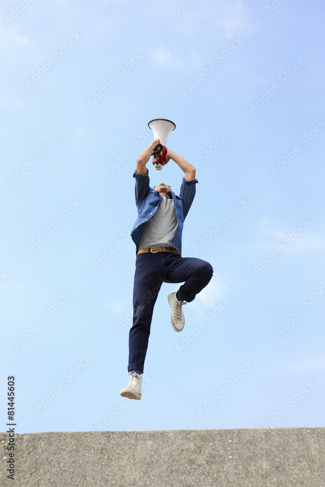 man jump and shout megaphone