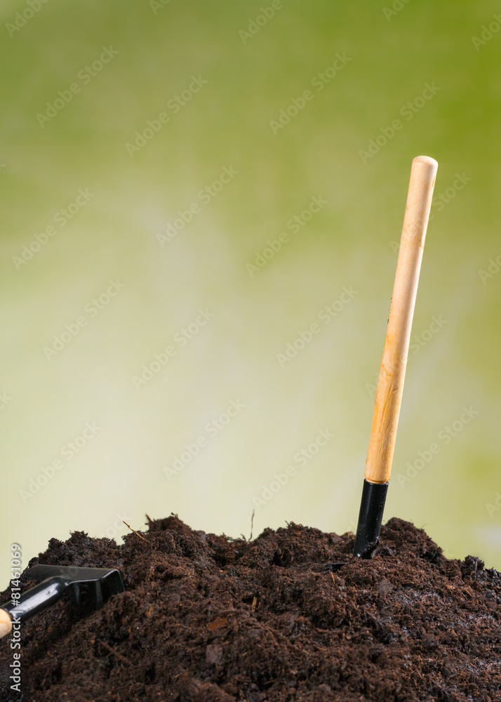 Pile of soil with green background