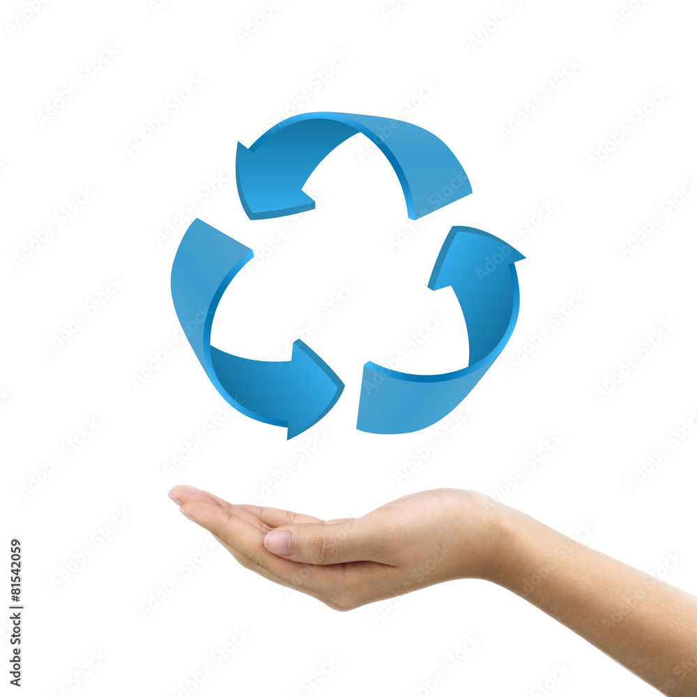 businessmans hand holding recycle sign