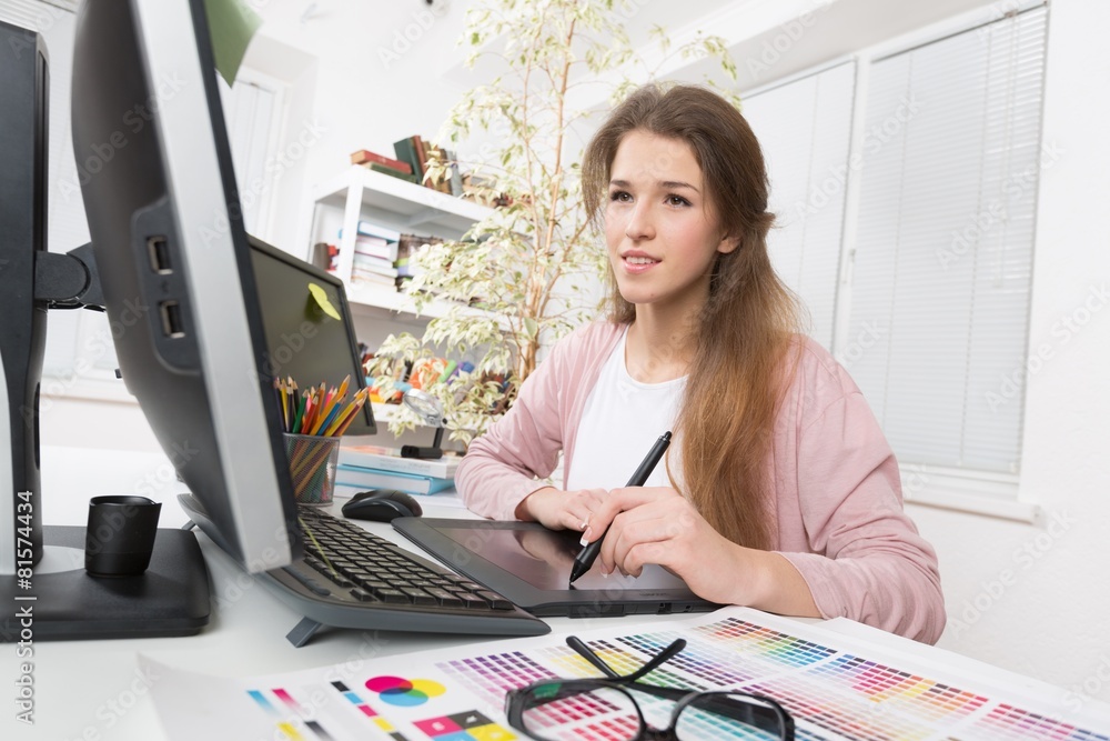 Adult. Side view of casual photo editors using graphics tablet