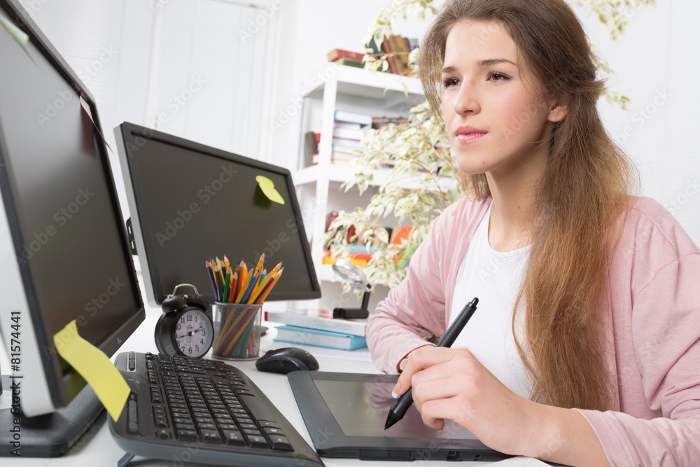 Adult. Side view of casual photo editors using graphics tablet