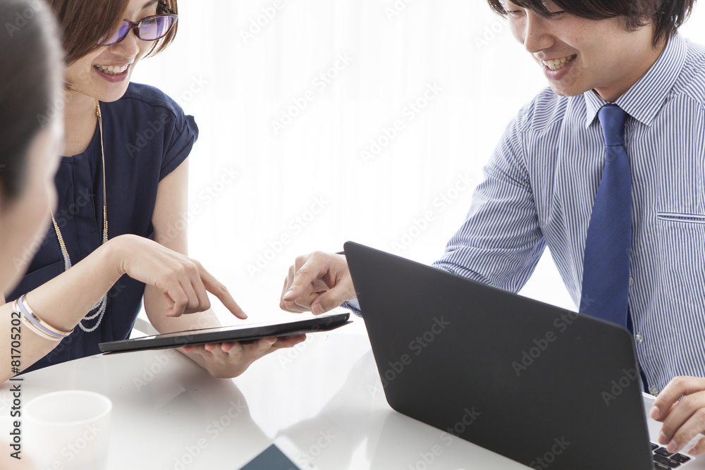 Men and women who are looking at the fun electronic tablet