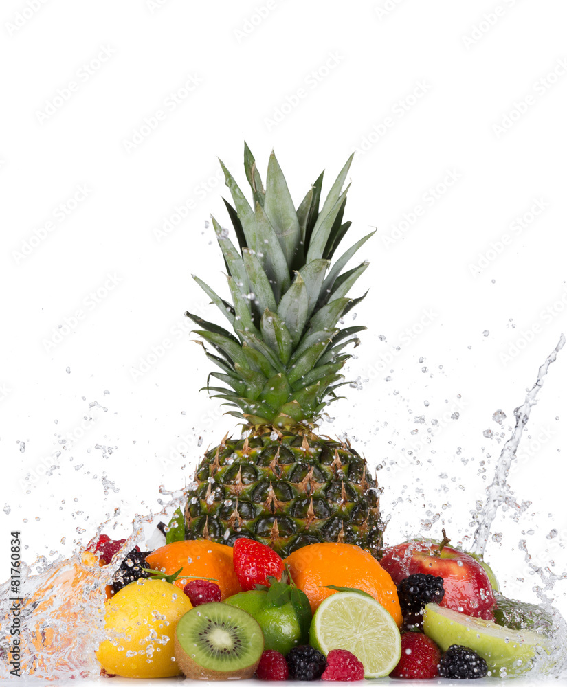 Mix of fruits with water splashes on white