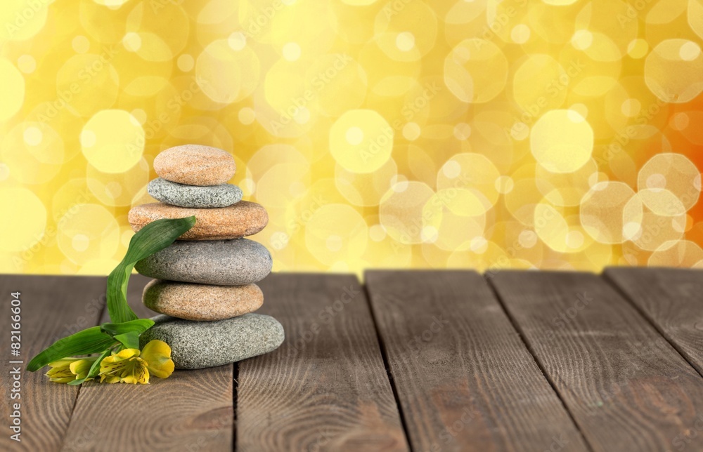 Abstract. Zen stones on the old wooden background