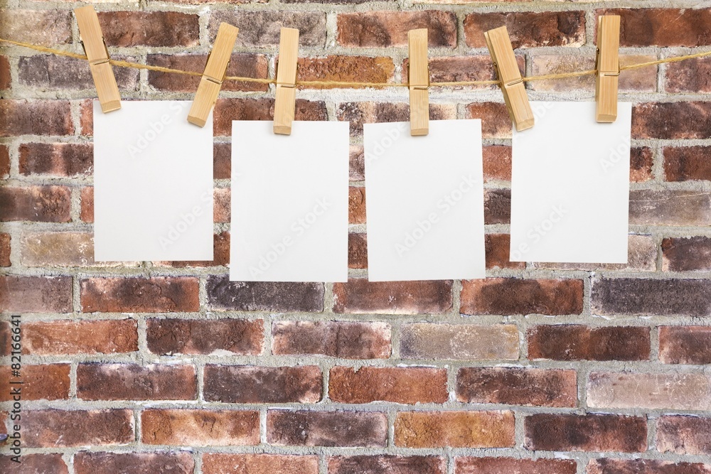 Background. Blank instant photos hanging on the clothesline