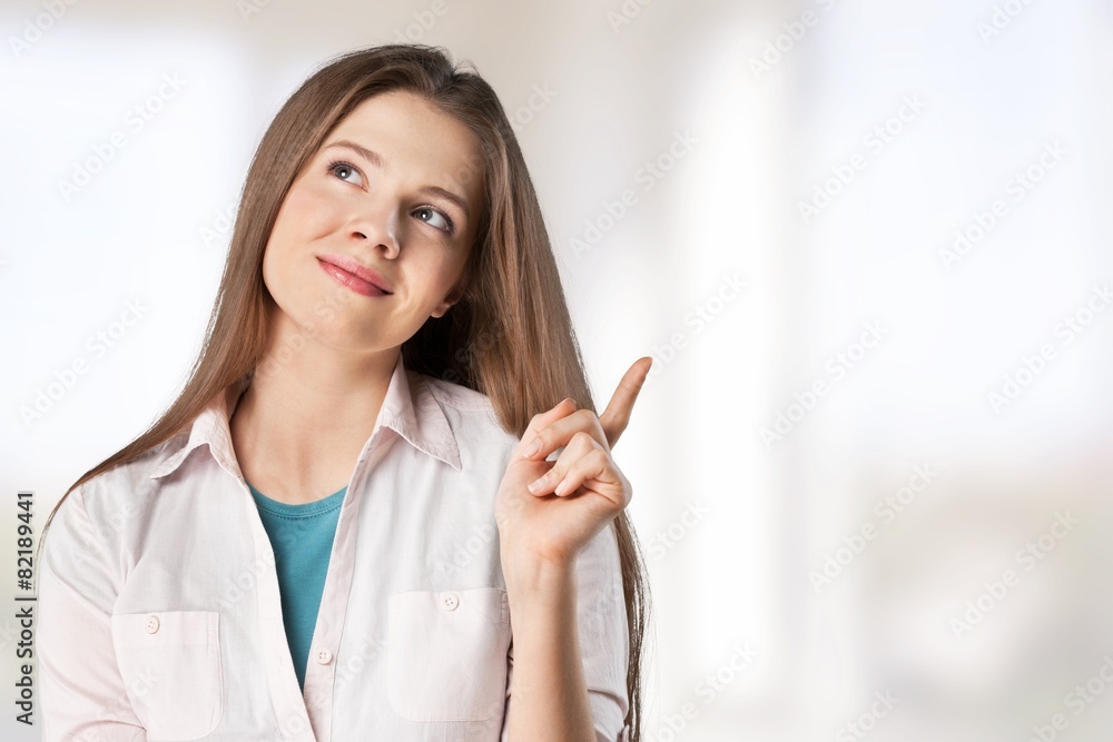 Idea. Beautiful business woman with idea light bulb above hand