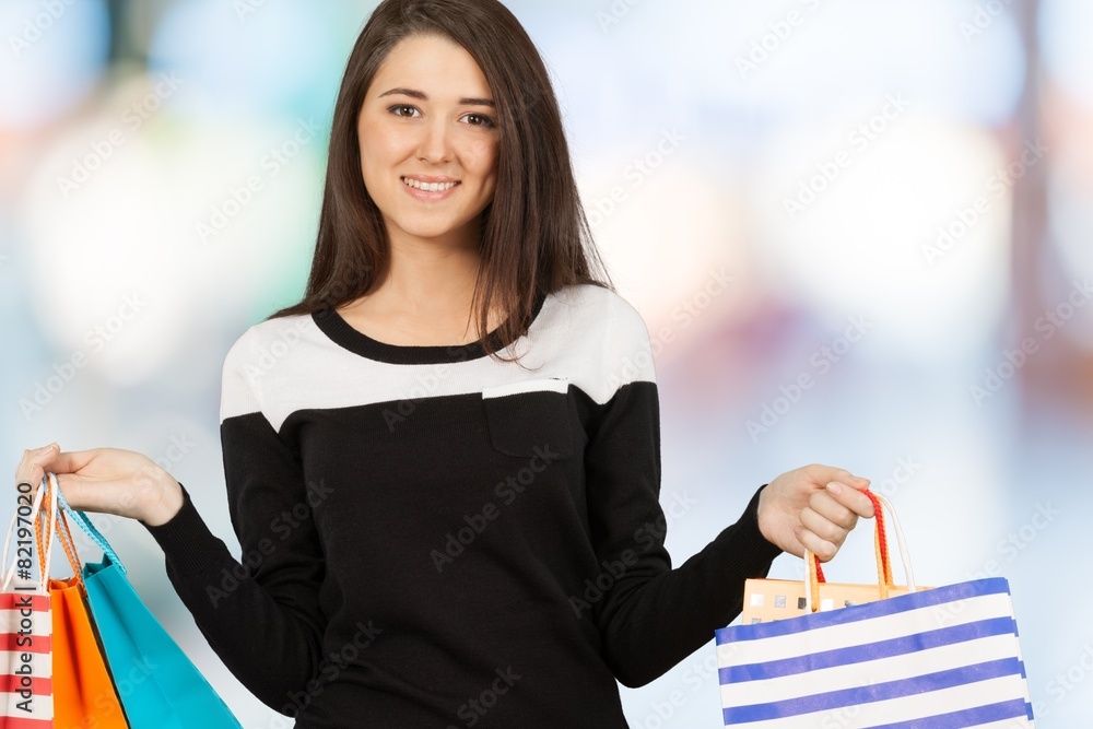 Shopping. Beautiful girl with her shopping bags