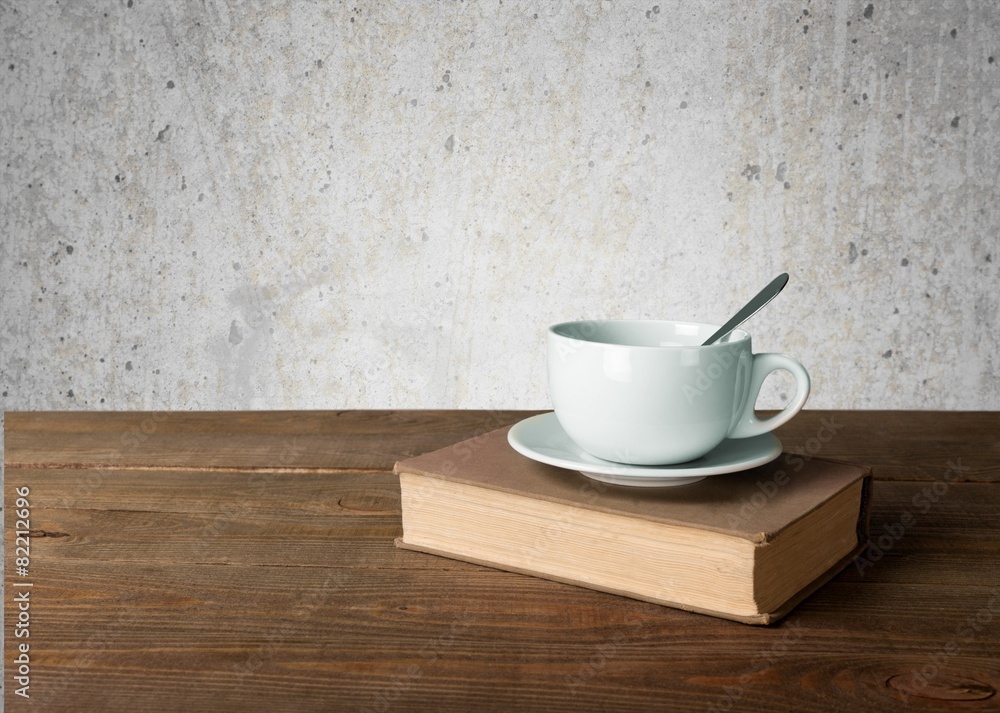 Tea. Cup of coffee and book on wooden table