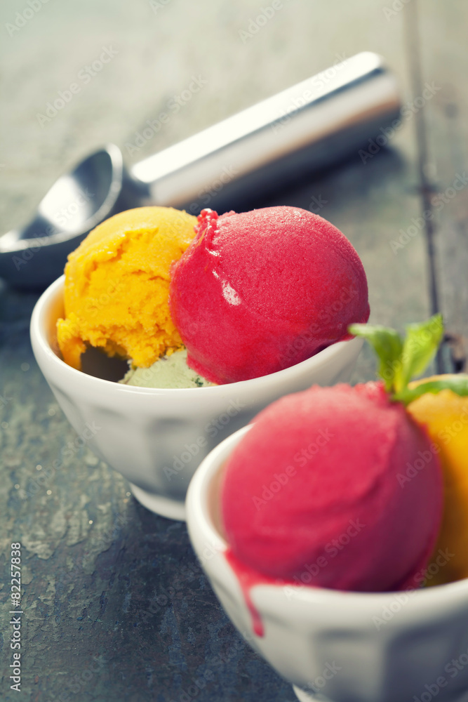 Two Ice cream scoops in bowls with wafer